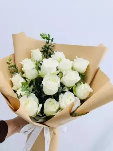 Photo of bouquet "Bouquet 13 White Roses Paper Wrap “Silent Whisper” Ayia Napa" — Flower delivery in Ayia Napa, photo 1 of 1