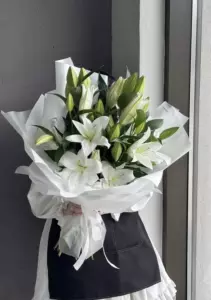 Photo of bouquet "Bouquet 9 White Lilies Silk Ribbon Embossed Paper “Silent Reverie” Dubai" — Dubai - Flowers Delivery Flowers Place, photo 1 of 1